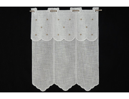 Window curtain with creme colored dots