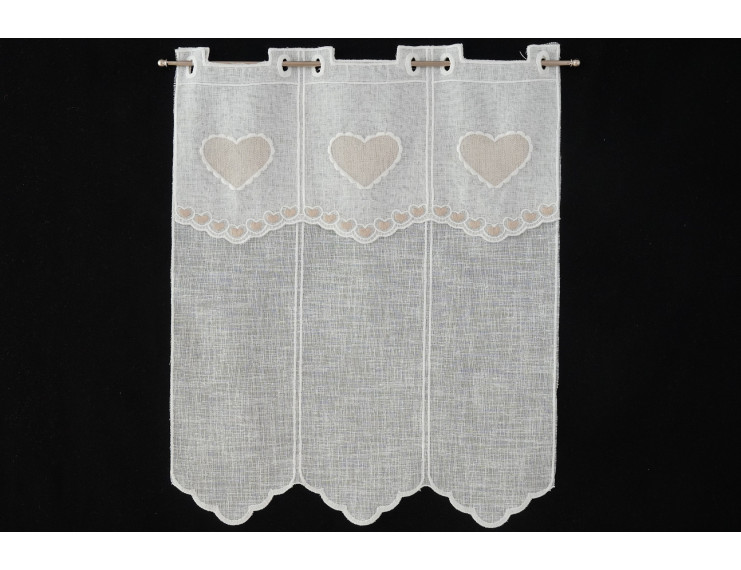 Window curtain with creme colored heart decoration