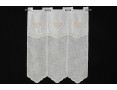 Window curtain with creme colored heart decoration