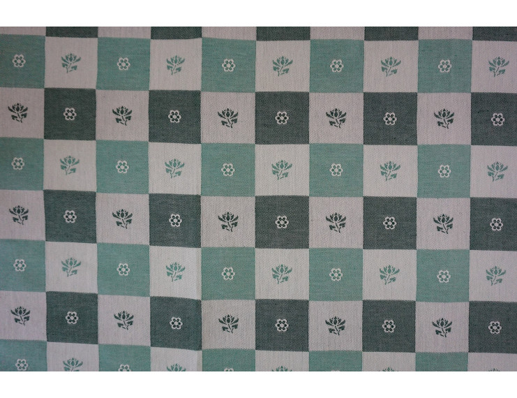Free sample green piece of fabric chequered with flowers